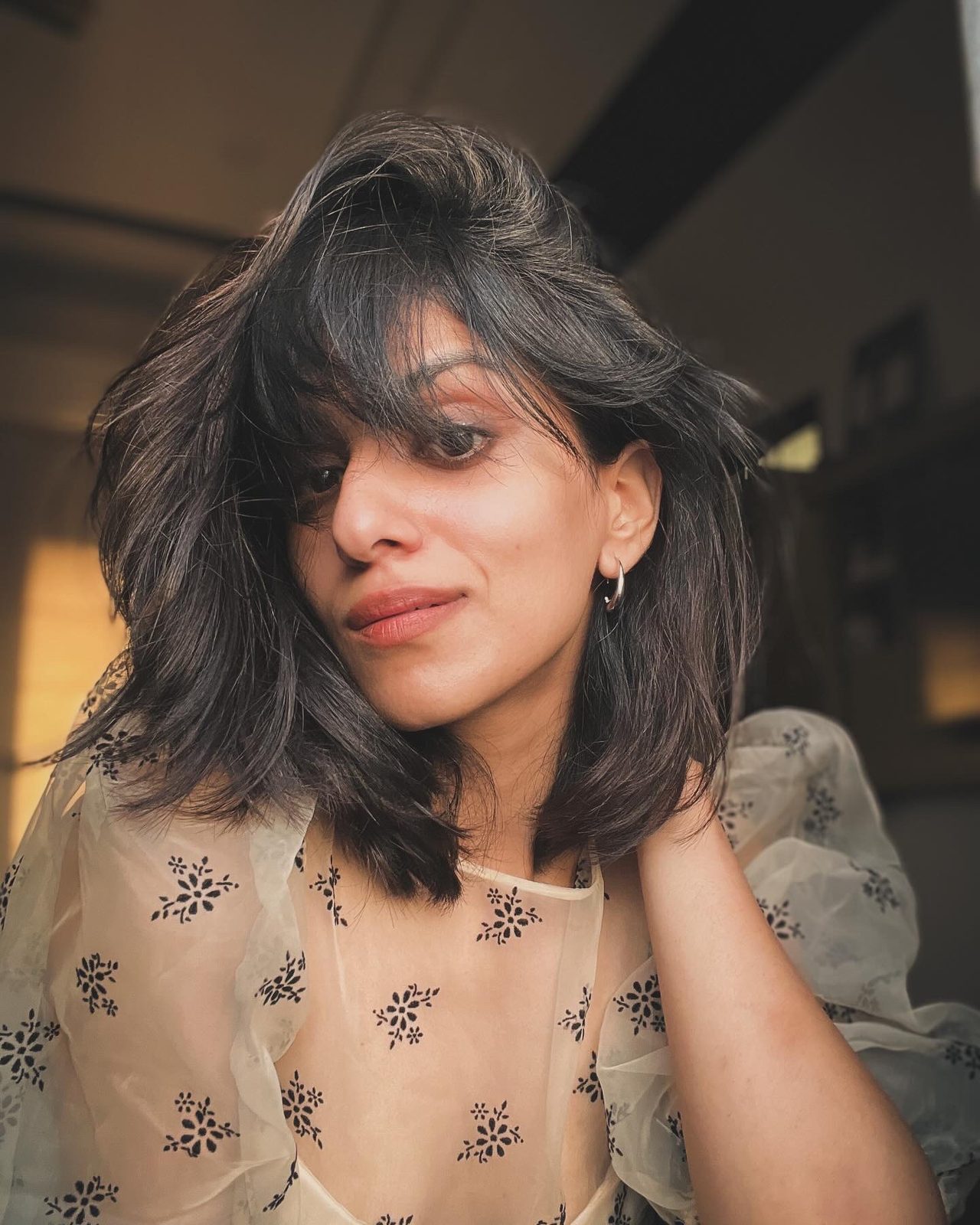 Siffaat Gandhi — sheer black-print blouse, candid daylight portrait