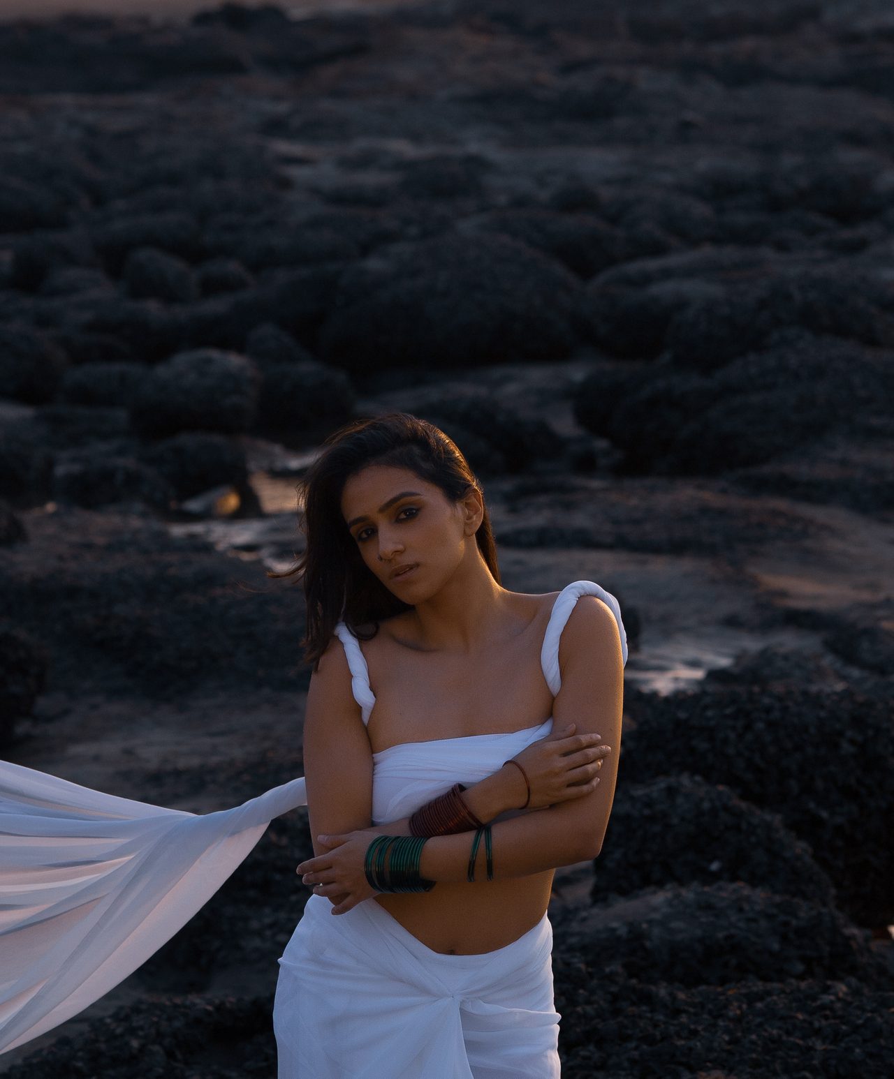 Siffaat Gandhi — black rocks, white drape, evening